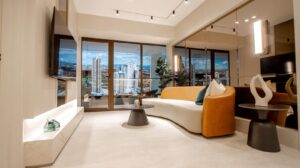 Living room with city views in the model apartment at Aurum, Panama City, Panama