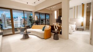 Living and dining area with city views in the model apartment at Aurum, Panama City, Panama